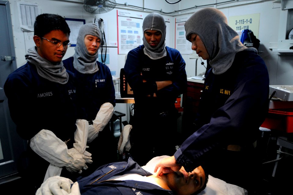 US Navy 091021-N-3830J-098 Cmdr. Tri Lac, medical officer aboard the amphibious command ship USS Blue Ridge (LCC 19),