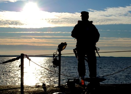 US Navy 091025-N-8750E-049 Sonar Technician (Submarine) 2nd Class Steve Spence, from Houston, Texas, stands sentry aboard the Los Angeles-class attack submarine USS Annapolis (SSN 760)