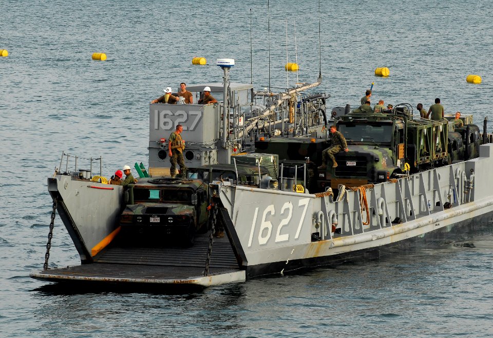 US Navy 091021-N-0807W-588 Landing Craft Utility (LCU) 1627 assigned to Assault Craft Unit (ACU) 1 transports Marines and their equipment to the well deck of the amphibious dock landing ship USS Harpers Ferry (LSD 49)