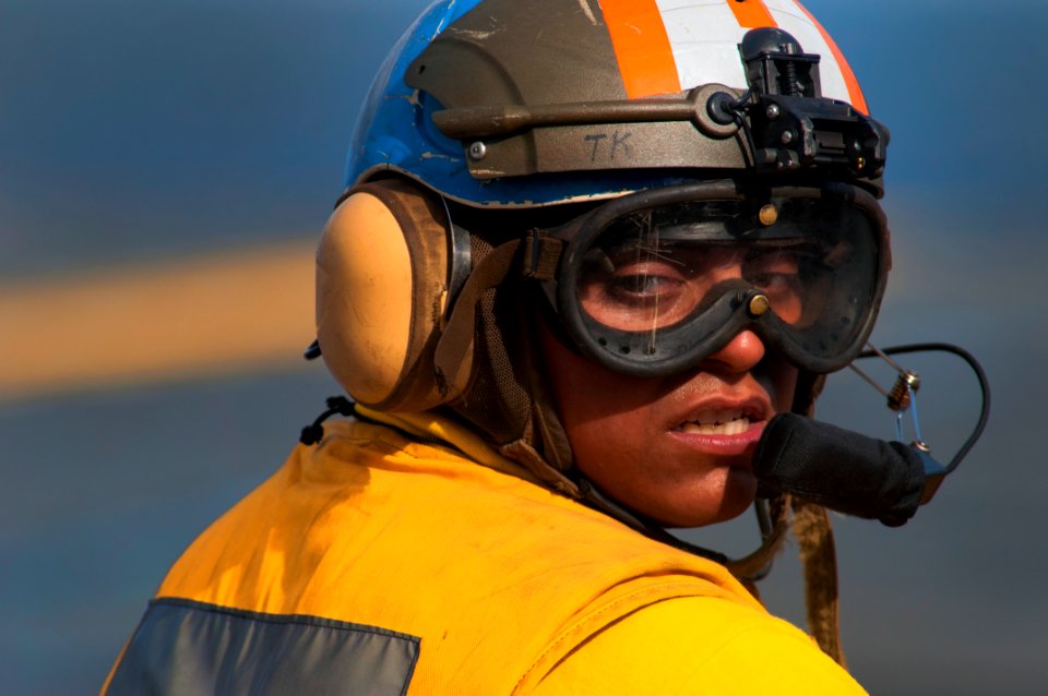 US Navy 091026-N-5319A-004 Aviation Boatswain's Mate (Handling) Airman Samual Meza, assigned to the amphibious assault ship USS Nassau (LHA 4), steers a flight deck tractor before flight operations