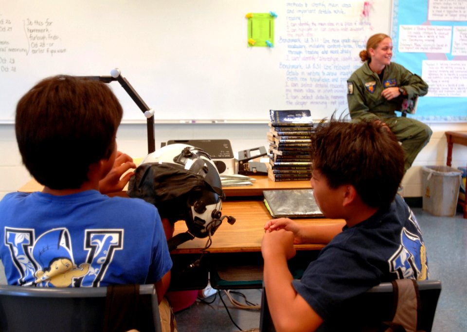 US Navy 091021-N-0535P-022 Naval Air Crewman 2nd Class Mehgan Rodriguez, assigned to Pacific Missile Range Facility, Kauai, Hawaii, describes her duties and experiences in the Navy during a career fair at Waimea Canyon Middle S