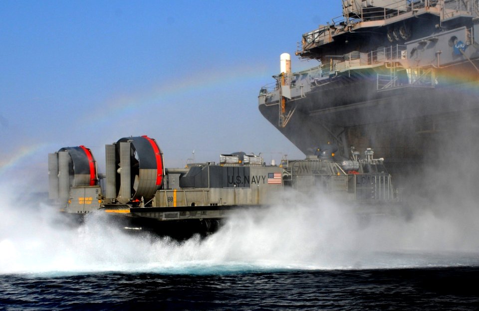 US Navy 091022-N-7508R-094 A landing craft air cushion from Assault Craft Unit (ACU) 4 exits the well deck of multipurpose amphibious assault ship USS Bataan (LHD 5) to conduct routine operations in the Gulf of Aqaba