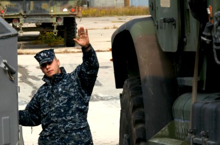 US Navy 091027-N-3592S-153 Engineman 2nd Class Stephen Weber, assigned to Landing Craft Utility 1655 (LCU 1655) directs the embarkation equipment from the 24th Marine Expeditionary Unit