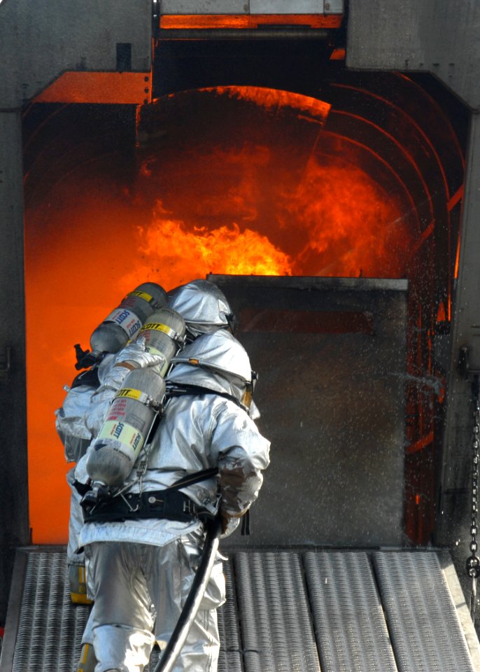US Navy 091023-N-8560K-099 Sailors assigned to the aircraft carriers USS George H.W. Bush (CVN 77) and USS Harry S. Truman (CVN 75) train with the Mobile Aircraft Firefighting Training Device aboard Harry S. Truman