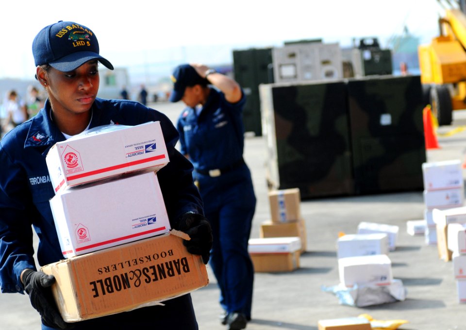 US Navy 091022-N-7508R-002 Logistics Specialist 2nd Class Bridgette FerronBarnes sorts mail for amphibious assault ship USS Bataan (LHD 5) while in port Aqaba, Jordan