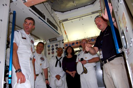 US Navy 091024-N-6220J-003 Navy Astronaut Capt. Mark Kelly, assigned to NASA, leads Sailors assigned to the aircraft carrier USS George H.W. Bush (CVN 77) through a behind-the-scenes tour of a mock-up training facility