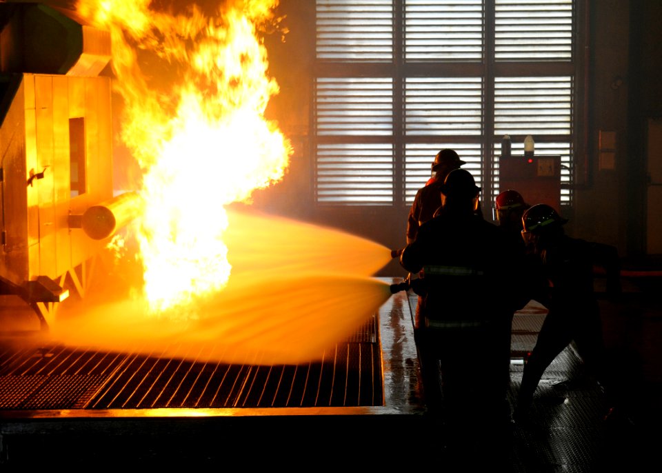 US Navy 091028-N-2638R-005 Sailors fight a helicopter fire during a shipboard aircraft firefighting class at the Center for Naval Engineering's Learning Site, Yokosuka