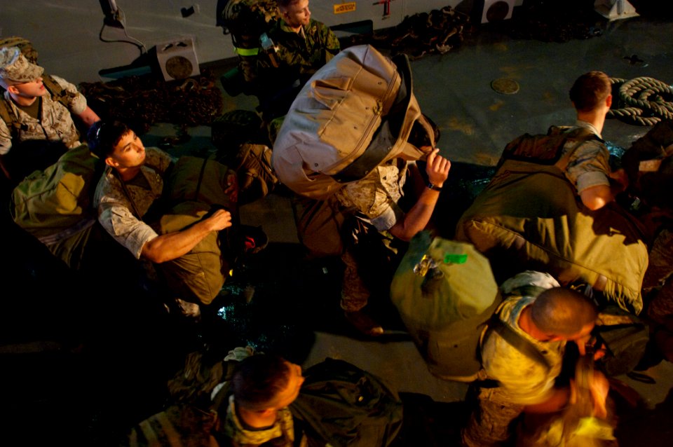 US Navy 091028-N-5700G-159 Marines assigned to the 24th Marine Expeditionary Unit (24th MEU) embark aboard the amphibious assault ship USS Nassau (LHA 4)