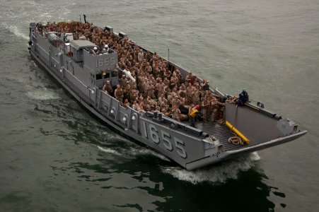 US Navy 091028-N-5319A-261 Marines from the 24th Marine Expeditionary Unit (24th MEU) are transported by Landing Craft Unit 1655 (LCU 1655) to the amphibious assault ship USS Nassau (LHA 4)