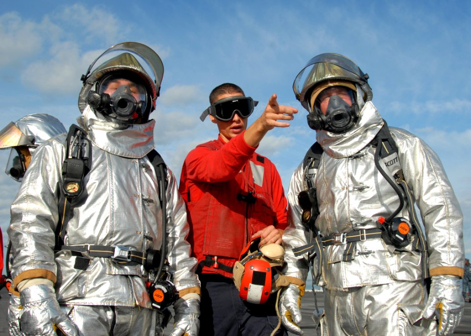US Navy 091023-N-8560K-060 Sailors assigned to the aircraft carrier USS George H.W. Bush (CVN 77) conduct joint training with the Mobile Aircraft Firefighting Training Device aboard the aircraft carrier USS Harry S. Truman (CVN