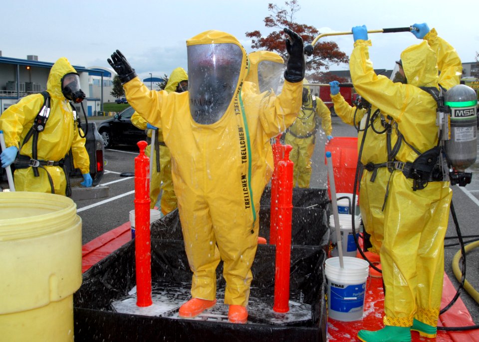 US Navy 091028-N-9860Y-006 Navy Region Northwest Fire and Emergency Services and Oak Harbor Fire Department personnel decontaminate the Navy Region Northwest Fire and Emergency Services initial entry team