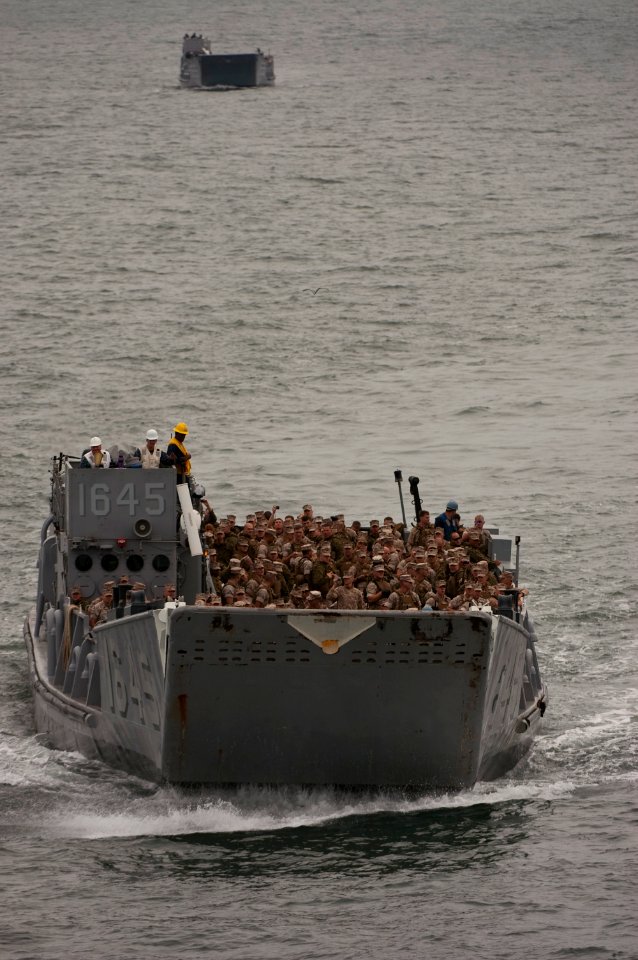 US Navy 091028-N-5319A-250 Marines from the 24th Marine Expeditionary Unit (24th MEU) are transported by Landing Craft Unit 1645 (LCU 1645) to the amphibious assault ship USS Nassau (LHA 4)