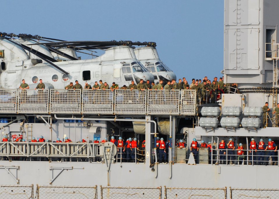 US Navy 091030-N-5538K-161 Sailors and Marines gather on the port side of the amphibious dock landing ship USS Harpers Ferry (LSD 49) before an underway replenishment