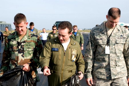 US Navy 091027-N-9552I-140 U.S. service members and members of the Italian Air Force 41st Stormo perform a foreign object debris walk-down on the flight-line at Naval Air Station Sigonella