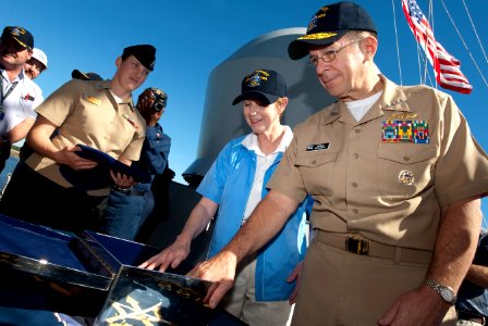 US Navy 091101-N-0696M-229 Adm. Mike Mullen, chairman of the Joint Chiefs of Staff, and his wife, Deborah Mullen, lay good luck pieces into a steel box