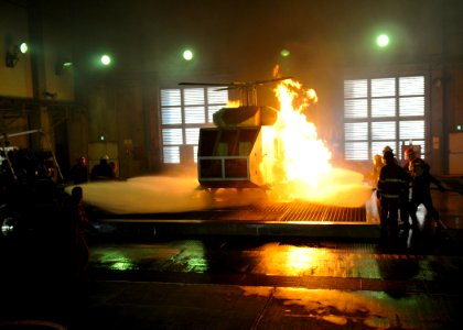 US Navy 091028-N-2638R-003 Sailors fight a helicopter fire during a shipboard aircraft firefighting class at the Center for Naval Engineering Learning Site, Yokosuka