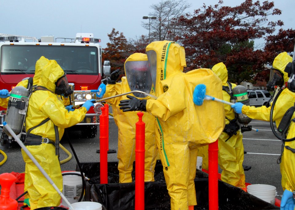 US Navy 091028-N-9860Y-005 Navy Region Northwest Fire and Emergency Services and Oak Harbor Fire Department personnel decontaminate the Navy Region Northwest Fire and Emergency Services initial entry team