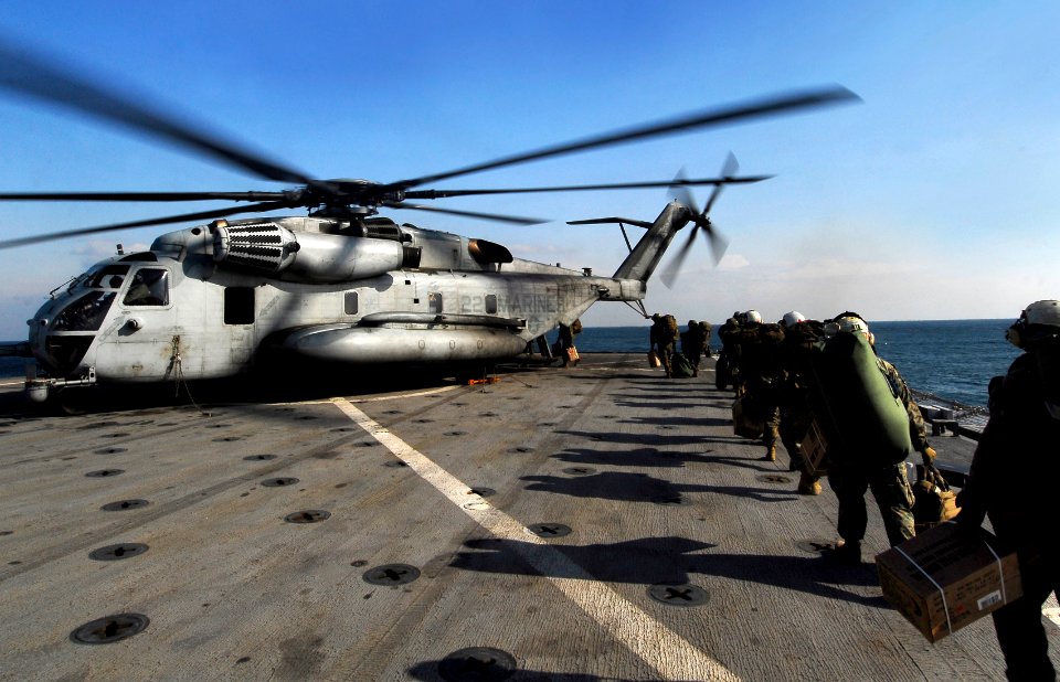 US Navy 091102-N-0807W-354 Marines assigned to the 31st Marine Expeditionary Unit (31st MEU) embarked aboard the amphibious dock landing ship USS Harpers Ferry (LSD 49) board a Marine Corps CH-53E Sea Stallion helicopter