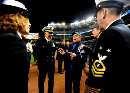 US Navy 091104-N-2147L-004 New York City Mayor Michael Bloomberg greets Cmdr. Curt Jones, commanding officer of the amphibious transport dock ship Pre-Commissioning Unit (PCU) New York (LPD 21) photo