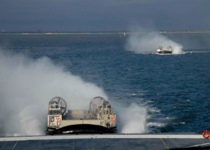 US Navy 091029-N-0924R-001 Landing craft, air cushion approach the amphibious transport dock ship Pre-Commissioning Unit (PCU) New York (LPD 21) after departing Naval Station Norfolk