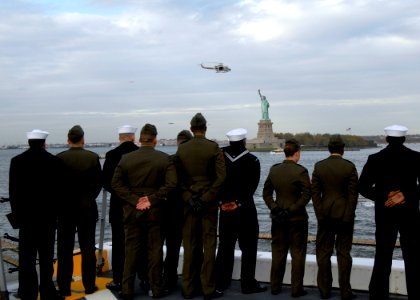 US Navy 091102-N-0924R-068 Sailors and Marines man the rails as the amphibious transport dock ship Pre-commissioning Unit (PCU) New York (LPD 21) passes the Statue of Liberty in New York Harbor