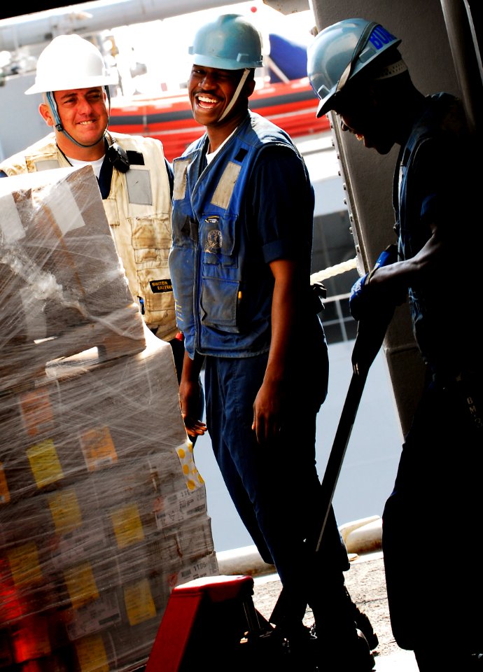 US Navy 091030-N-0807W-481 Sailors aboard the amphibious dock landing ship USS Harpers Ferry (LSD 49) bring aboard stores from the Military Sealift Command fleet replenishment oiler USNS John Ericsson (T-AO 194)
