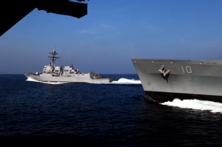 US Navy 091104-N-3038W-462 The guided-missile destroyer USS Sampson (DDG 102) transits away from the Military Sealift Command fast combat support ship USNS Bridge (T-AOE 10)