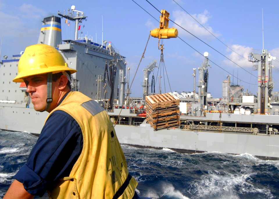 US Navy 091030-N-5538K-196 Boatswain's Mate 2nd Class Kevin J. Dunlavey directs the movement of a cargo drop reel aboard the amphibious transport dock ship USS Denver (LPD 9)