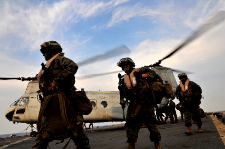 US Navy 091104-N-0807W-422 Marines assigned to the 31st Marine Expeditionary Unit (31st MEU) disembark a Marine Corps CH-46 helicopter aboard the amphibious dock landing ship USS Harpers Ferry (LSD 49)