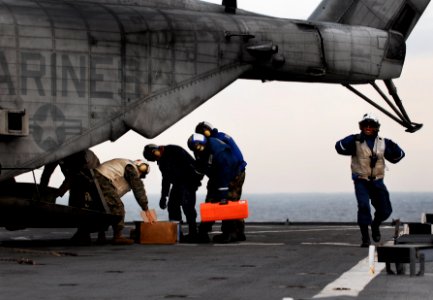 US Navy 091105-N-0807W-185 Sailors and Marines aboard USS Harpers Ferry (LSD 49) offload supplies and equipment from a Marine Corps CH-53E Sea Stallion helicopter