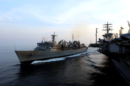 US Navy 091104-N-3038W-153 The Military Sealift Command fast combat support ship USNS Bridge (T-AOE 10) transits alongside the aircraft carrier USS Nimitz (CVN 68) during a replenishment at sea