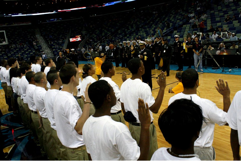 US Navy 091104-N-6736S-274 Rear Adm. Vic Guillory swears in 35 Sailors into the Delayed Entry Program while attending a New Orleans Hornets game