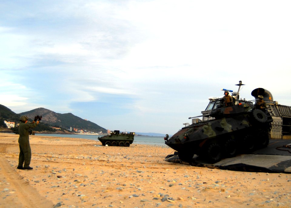 US Navy 091104-N-5538K-168 A U.S. Marine Corps light armored vehicle assigned to the 31st Marine Expeditionary Unit (31st MEU) disembarks a U.S. Navy landing craft, air cushion during an amphibious assault exercise