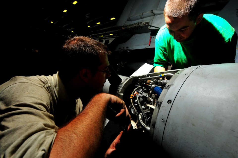 US Navy 091101-N-4053P-011 Aviation Structural Mechanic 3rd Class Jacob Kozanecki, left and Aviation Electrician's Mate 2nd Class Todd Hofacker, both assigned to the aircraft carrier USS Mimitz (CVN 68)