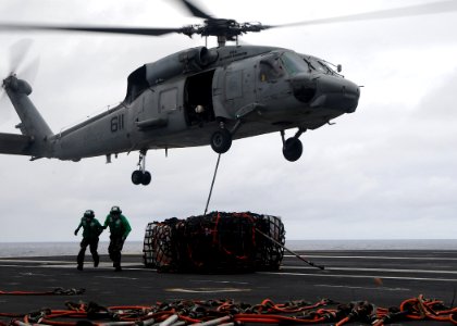 US Navy 091105-N-6233H-088 An SH-60F Sea Hawk helicopter assigned to the Chargers of Helicopter Anti-Submarine Squadron (HS) 14 lifts cargo from the aircraft carrier USS George Washington (CVN 73)