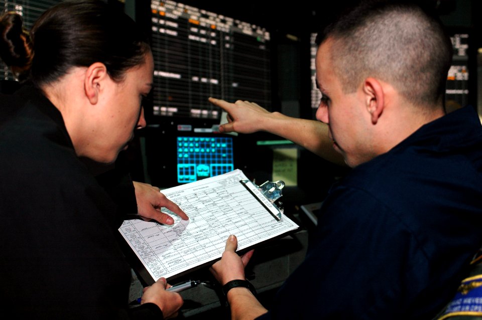 US Navy 091101-N-8960W-007 Air Traffic Controller 3rd Class Colby Wing, right, and Air Traffic Controller 2nd Class Yolonda Manny, both assigned to the aircraft carrier USS Nimitz (CVN 68)