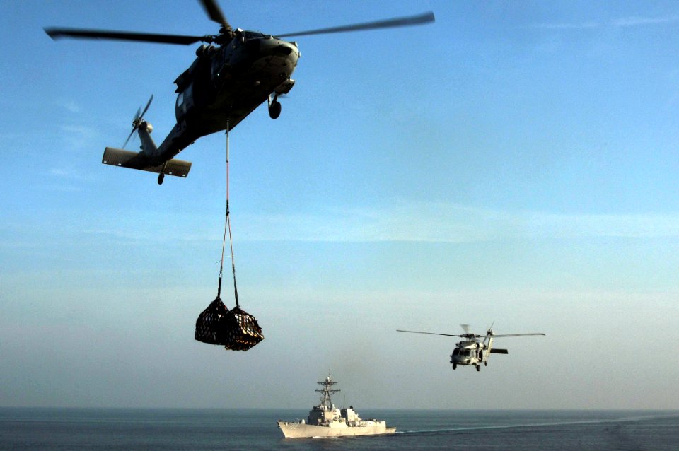 US Navy 091104-N-3038W-340 Two MH-60S Sea Hawk helicopters assigned to the Wildcards of Helicopter Sea Combat Squadron (HSC) 23