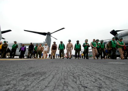 US Navy 091102-N-6439C-016 Air Department personnel conduct a foreign object debris walk down before flight operations aboard the amphibious assault ship USS Nassau (LHA 4)
