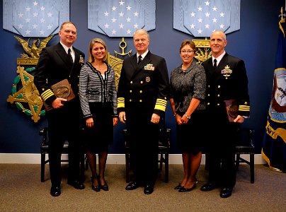 US Navy 091103-N-8273J-028 Chief of Naval Operations (CNO) Adm. Gary Roughead, middle, poses for a photo with Capt. William J. Parker, left, and Cmdr. Robert A. Baughman
