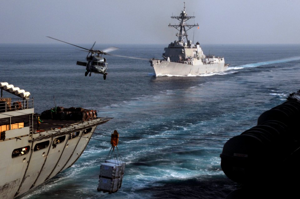 US Navy 091104-N-3038W-403 The guided-missile destroyer USS Sampson (DDG 102) trails the Military Sealift Command fast combat support ship USNS Bridge (T-AOE 10) and the aircraft carrier USS Nimitz (CVN 68)