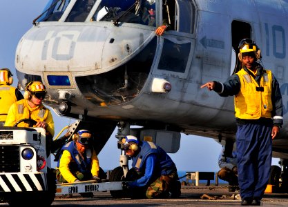 US Navy 091105-N-0807W-553 Flight deck Sailors aboard USS Harpers Ferry (LSD 49) prepare to move a Marine Corps CH-46 Sea Knight helicopter
