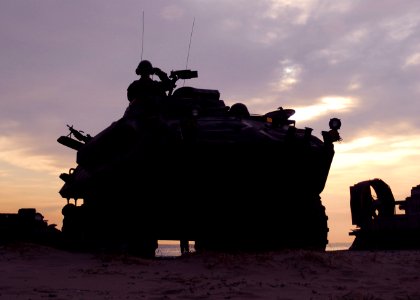 US Navy 091104-N-5538K-209 A U.S. Marine Corps light armored vehicle assigned to the 31st Marine Expeditionary Unit (31st MEU) moves up the beach during an amphibious assault exercise