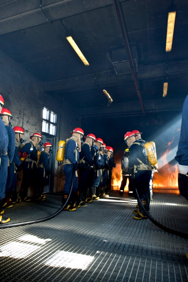 US Navy 091106-N-2953W-022 An attack team of Sailors assigned to the aircraft carrier USS Carl Vinson (CVN 70) and other area commands attempts to extinguish a fire during the Basic Shipboard Firefighting Course at Farrier Fire