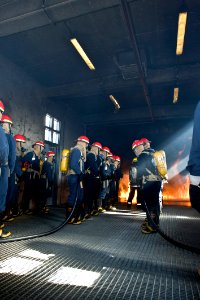 US Navy 091106-N-2953W-022 An attack team of Sailors assigned to the aircraft carrier USS Carl Vinson (CVN 70) and other area commands attempts to extinguish a fire during the Basic Shipboard Firefighting Course at Farrier Fire photo