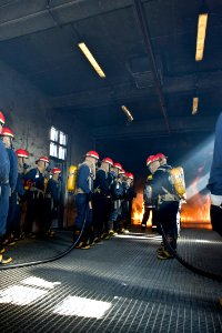 US Navy 091106-N-2953W-022 An attack team of Sailors assigned to the aircraft carrier USS Carl Vinson (CVN 70) and other area commands attempts to extinguish a fire during the Basic Shipboard Firefighting Course at Farrier Fire
