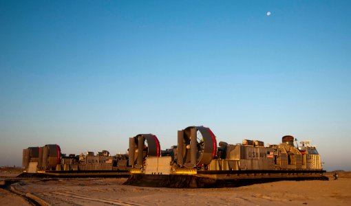 US Navy 091105-N-5319A-085 Landing craft, air cushion (LCAC) from Assault Craft Unit (ACU) 4, embarked aboard the amphibious assault ship USS Nassau (LHA 4), wait for Marines from the 24th Marine Expeditionary Unit (24th MEU) t