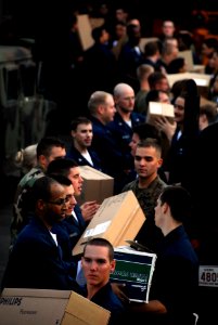US Navy 091106-N-0807W-862 Sailors and Marines aboard the amphibious dock landing ship USS Harpers Ferry (LSD 49) move supplies during a vertical replenishment