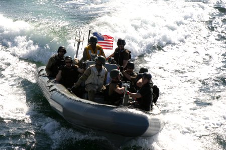 US Navy 091105-N-1329D-001 Members of the visit board, search and seizure team of the guided-missile cruiser USS Normandy (CG 60) race toward a simulated suspect vessel