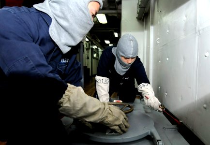 US Navy 091105-N-7280V-195 Machinist's Mate Fireman Bianca Cruz and Machinist's Mate Fireman Zhicai Lu set material condition Yoke after a general quarters