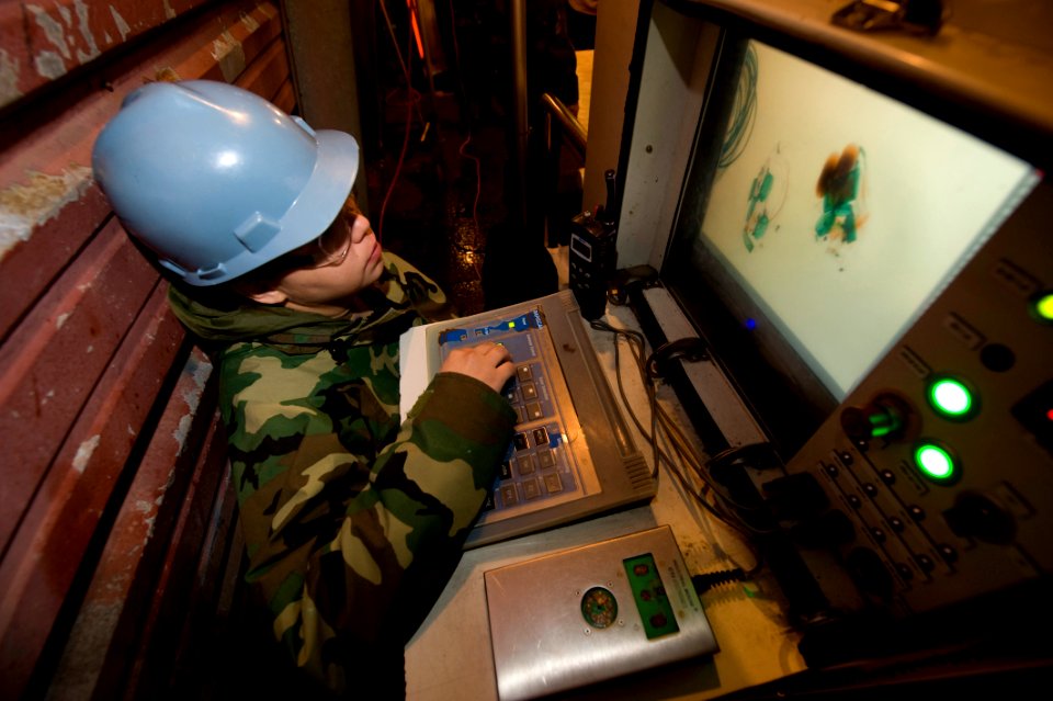 US Navy 091105-N-2953W-003 Aviation Ordnanceman 3rd Class Maria Arguijo, assigned to the aircraft carrier USS Carl Vinson (CVN 70), uses an X-ray machine on the quarterdeck
